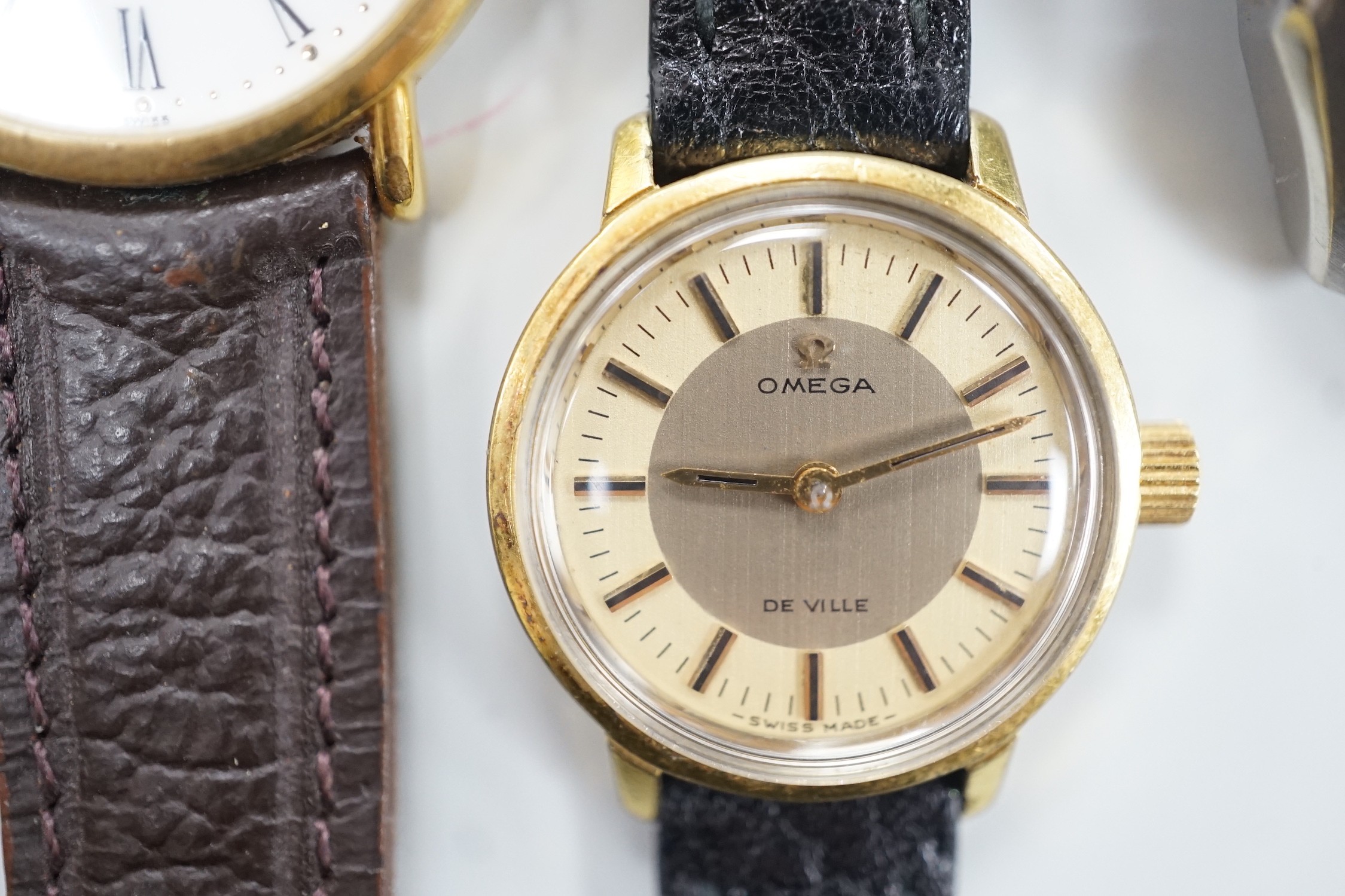 Five assorted wrist watches including lady's gold plated Omega De Ville, with box, a lady's and gentleman's steel and gold plated Rado, Raymond Weil and Casio digital.